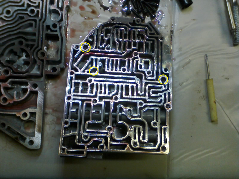 I forgot to take a clean version of this pic, but here is a reminder of where the check-balls go before we attach the transfer plate